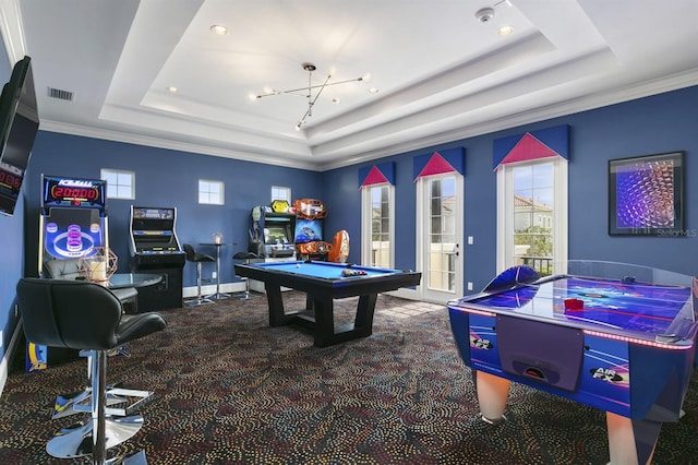 game room featuring pool table, a raised ceiling, carpet flooring, and ornamental molding