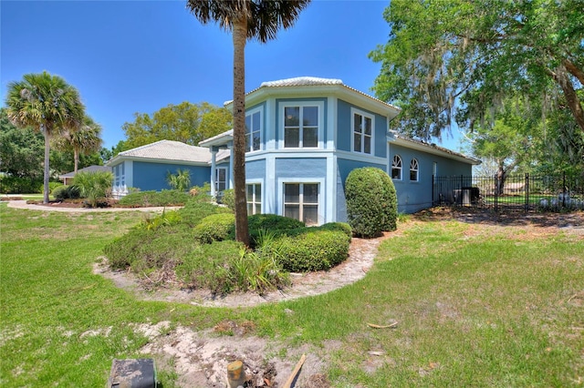 rear view of property featuring a yard