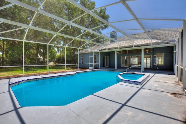 view of swimming pool featuring a patio and a lanai