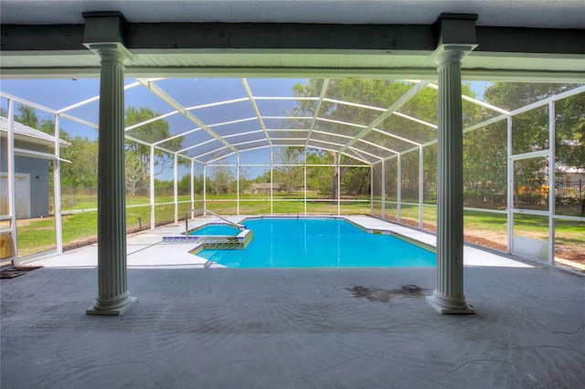 view of pool with a patio and a lanai