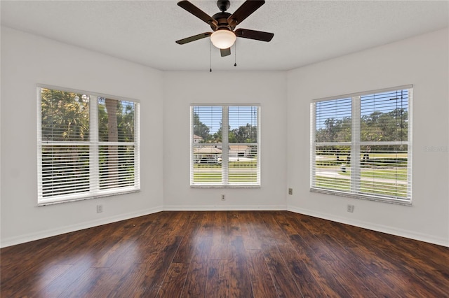 empty room featuring dark hardwood / wood-style floors and ceiling fan