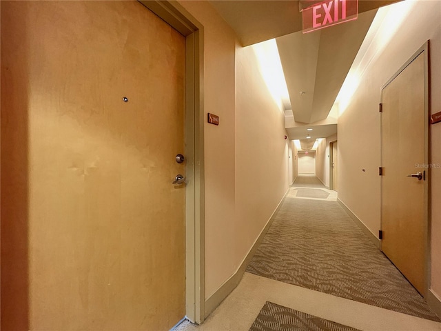 corridor with carpet flooring