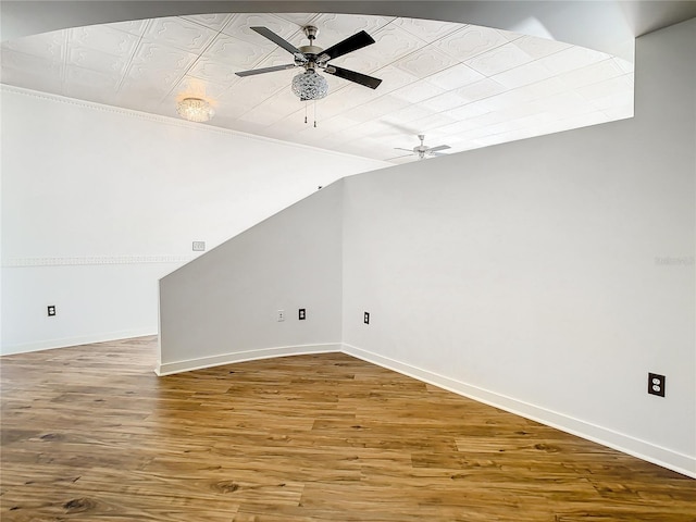 bonus room with hardwood / wood-style floors, vaulted ceiling, and ceiling fan