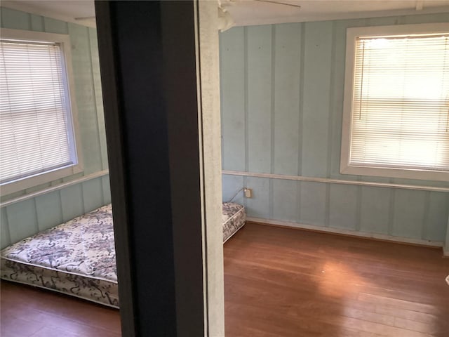 bedroom featuring ceiling fan and dark hardwood / wood-style flooring