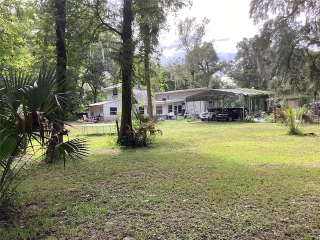 view of yard with a carport