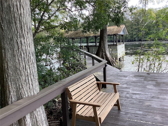 wooden deck with a water view