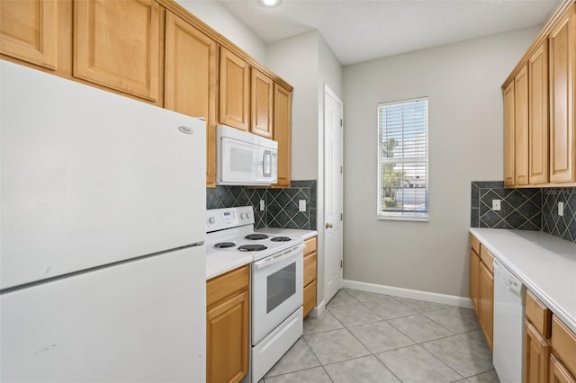 kitchen with white appliances, backsplash, and light tile patterned flooring