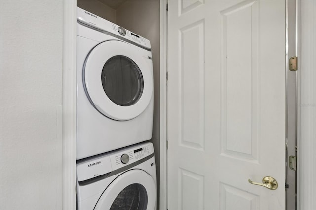 laundry area featuring stacked washer and clothes dryer