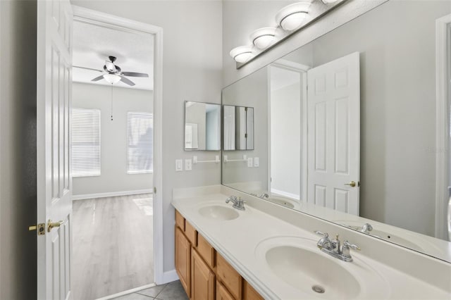 bathroom with vanity and ceiling fan