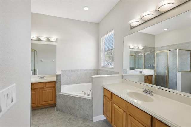 bathroom featuring tile patterned flooring, vanity, and independent shower and bath