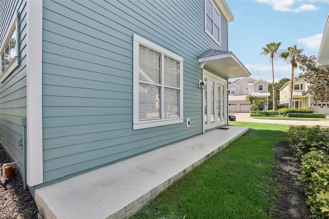 view of home's exterior with a lawn