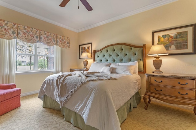 carpeted bedroom featuring crown molding and ceiling fan