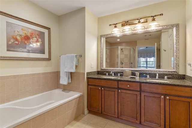 bathroom featuring double sink, tile floors, large vanity, and independent shower and bath