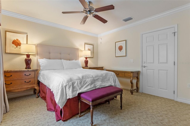 carpeted bedroom with ceiling fan and ornamental molding