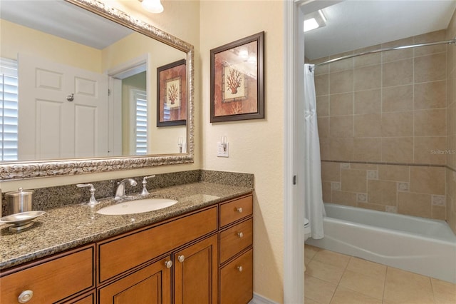 full bathroom with oversized vanity, toilet, tile floors, and shower / tub combo with curtain