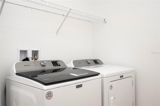 laundry area with washer hookup and separate washer and dryer