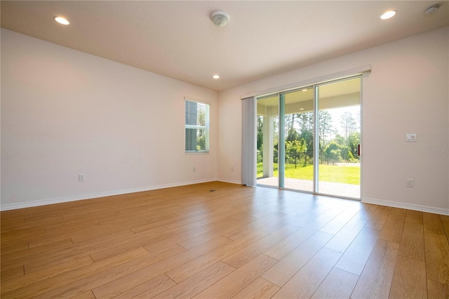 spare room with light wood-type flooring