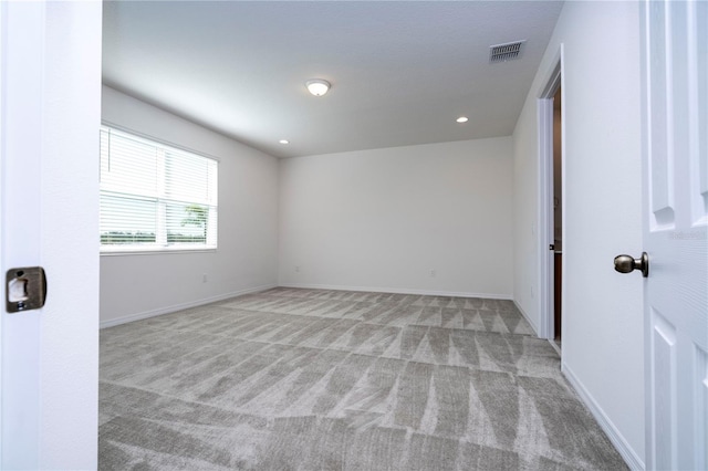 unfurnished room with carpet