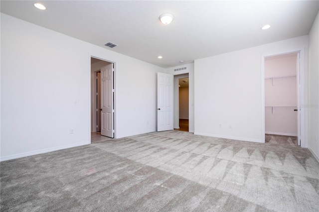 unfurnished room with light carpet