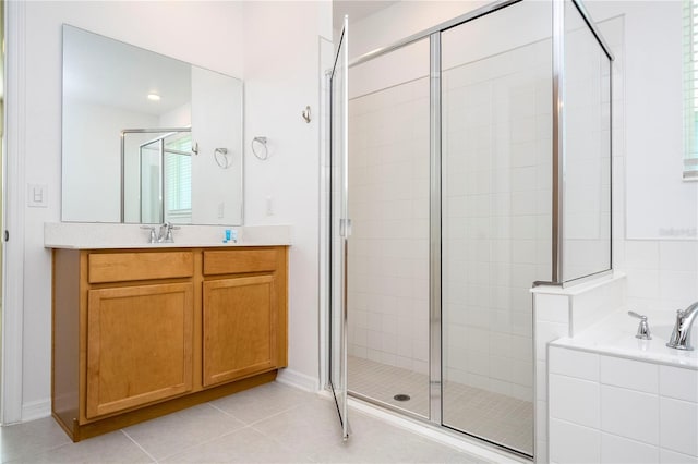 bathroom featuring tile floors, vanity, and plus walk in shower