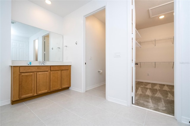 bathroom featuring tile flooring and vanity