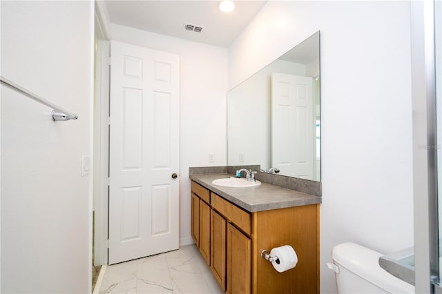 bathroom with oversized vanity, toilet, and tile flooring