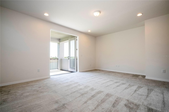 unfurnished room featuring carpet floors