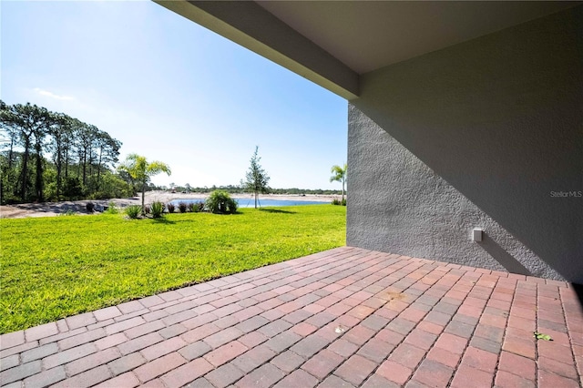 view of terrace with a water view