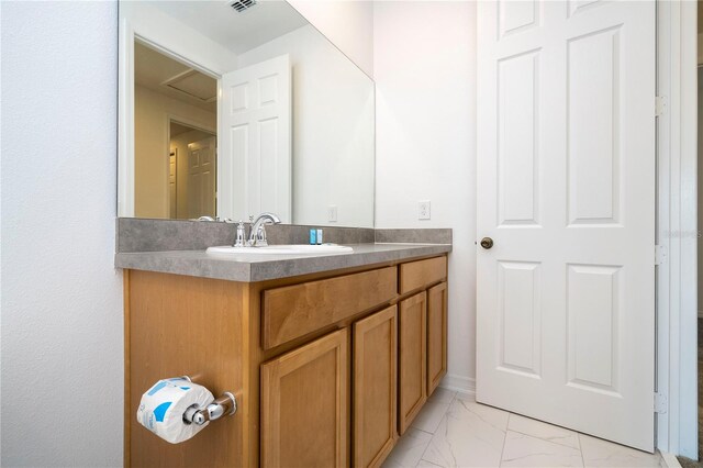 bathroom featuring tile flooring and vanity