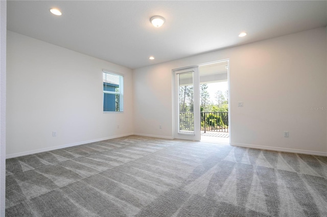 unfurnished room with carpet flooring