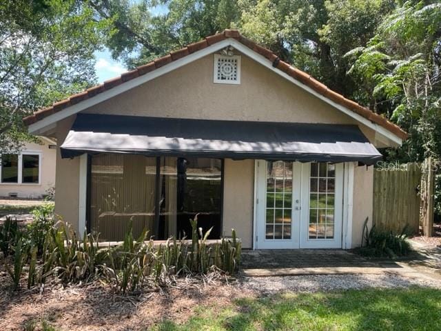 back of property featuring french doors