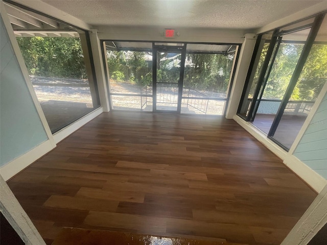 unfurnished sunroom featuring a healthy amount of sunlight