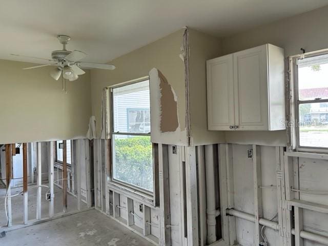 interior space featuring ceiling fan