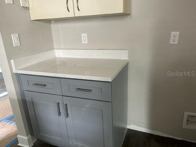 interior space with vanity and dark hardwood / wood-style floors