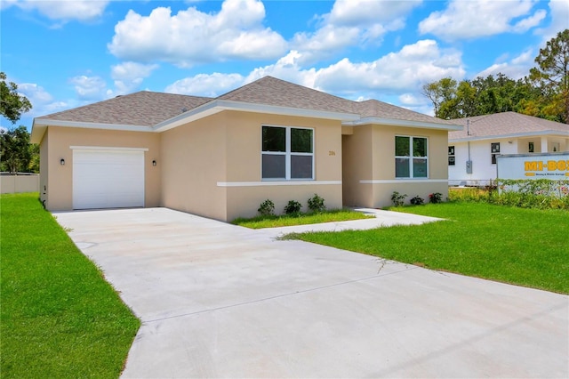 view of front of home featuring a front yard and a garage