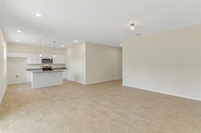 unfurnished living room featuring light tile floors