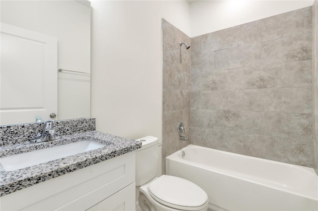 full bathroom with vanity, toilet, and tiled shower / bath