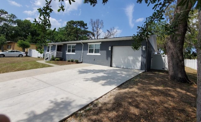 ranch-style home featuring a garage