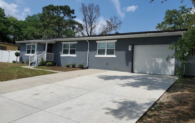 single story home featuring a garage