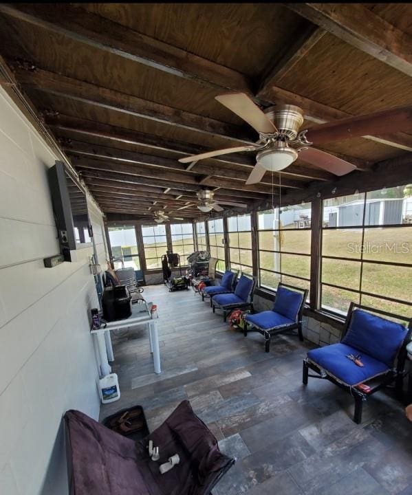 exterior space featuring ceiling fan