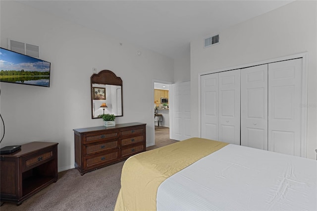 carpeted bedroom featuring a closet