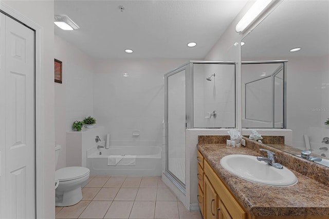 full bathroom with vanity, independent shower and bath, toilet, and tile patterned floors