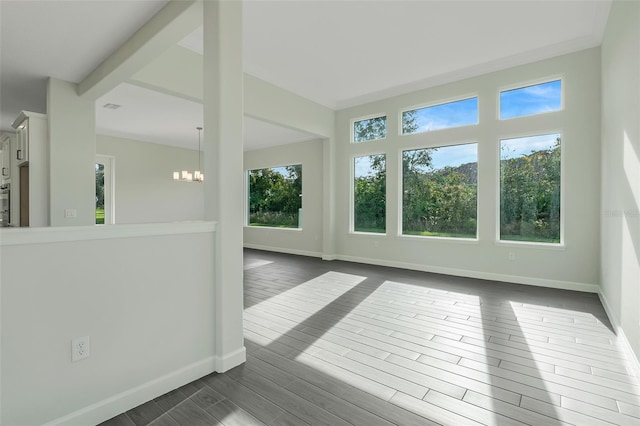 unfurnished sunroom with a chandelier