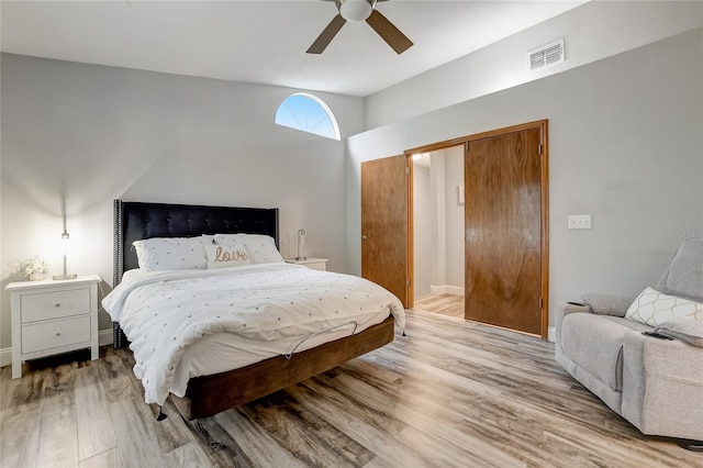 bedroom with ceiling fan and light hardwood / wood-style flooring