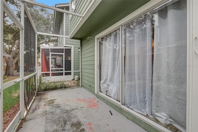 view of side of property with a patio area