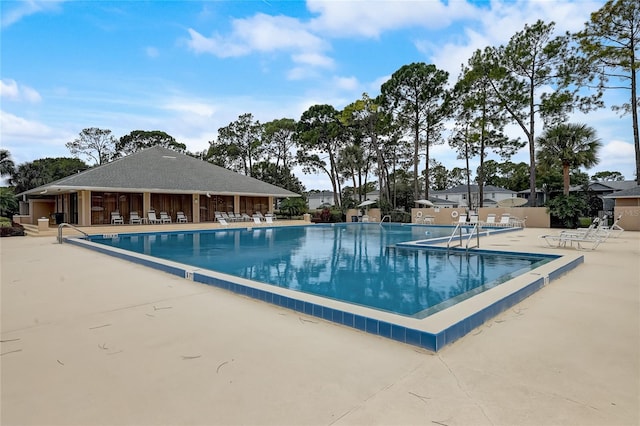 view of pool featuring a patio