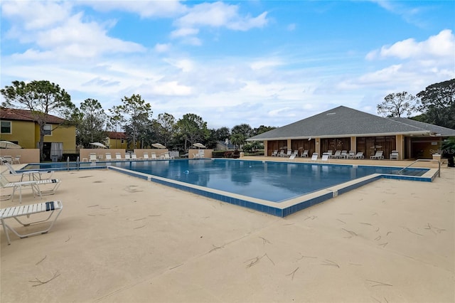 view of swimming pool featuring a patio area