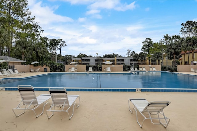 view of swimming pool with a patio area