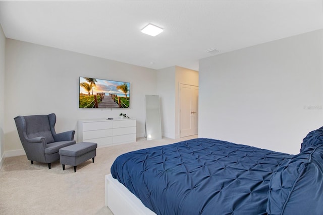 bedroom with light colored carpet