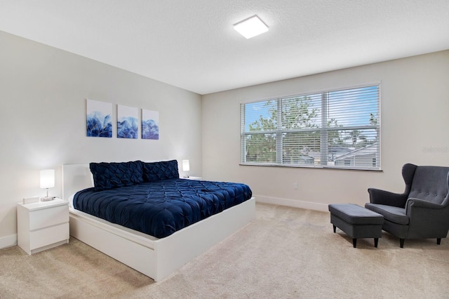 bedroom featuring light colored carpet